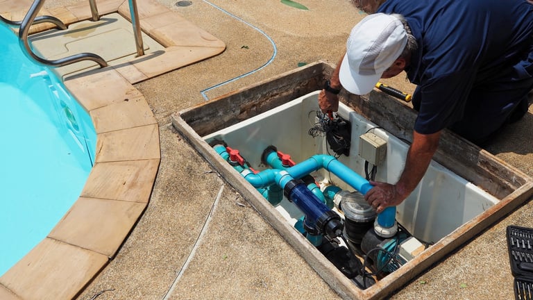 Pool technician repairing swimming pool equipment
