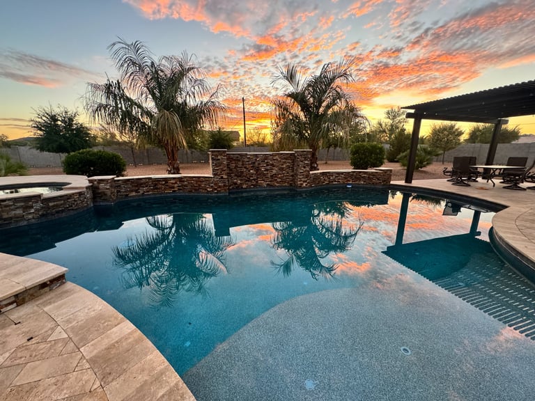 Desert backyard with pool and pergola