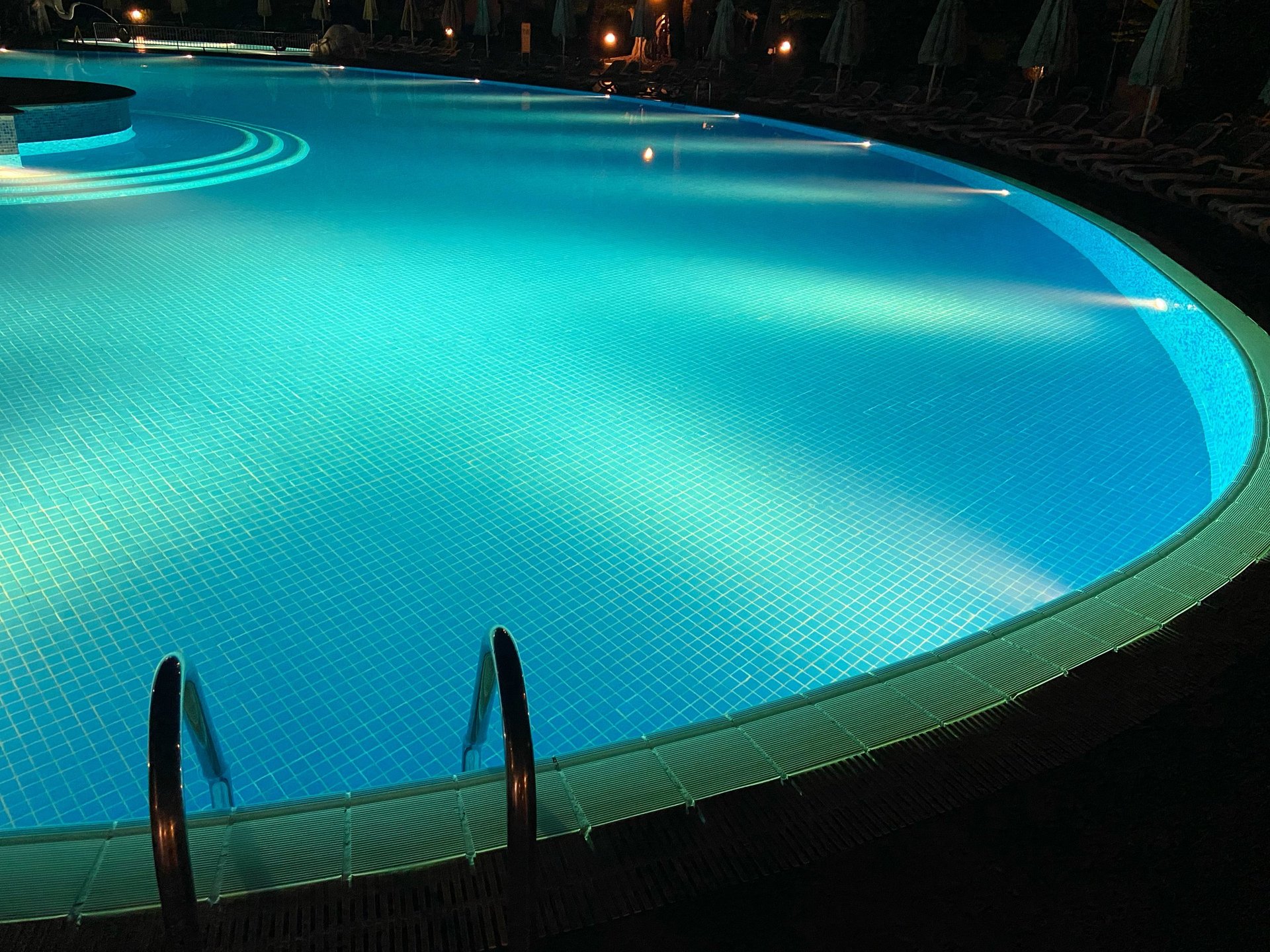 Pool at night with underwater lights