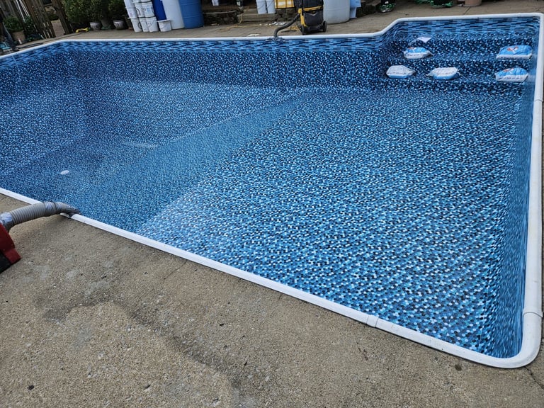 Blue vinyl-lined swimming pool with underwater lights